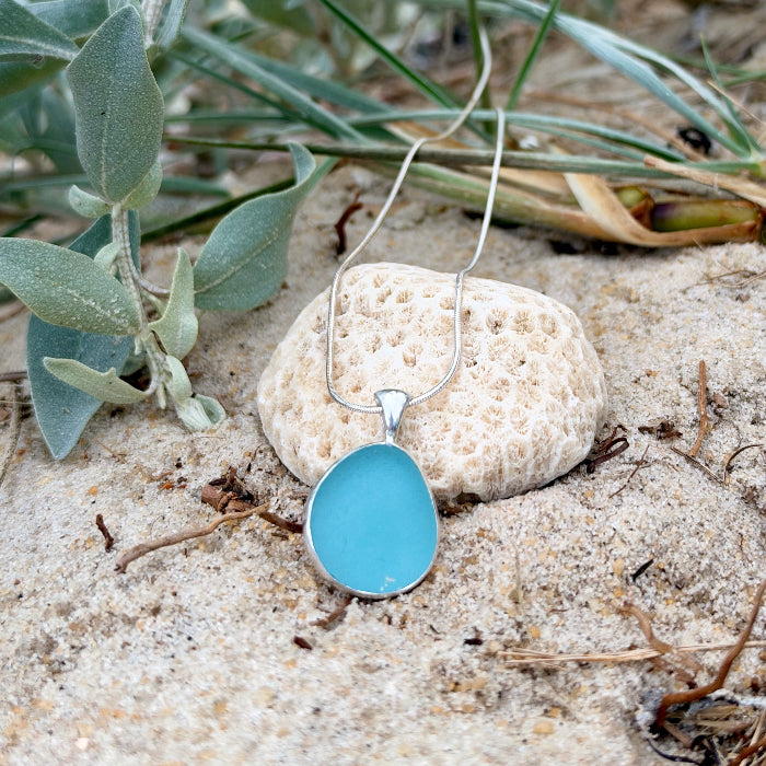 Ocean blue sea glass handset in Argentium silver by Mornington Sea Glass. Hangs on a 40 or 45cm sterling  silver snake chain.