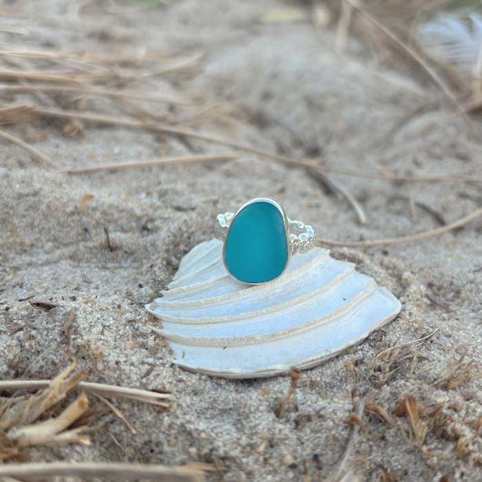 Ocean Teal sea glass set in silver on organic rippled  ring band by Mornington Sea Glass. Size 7.