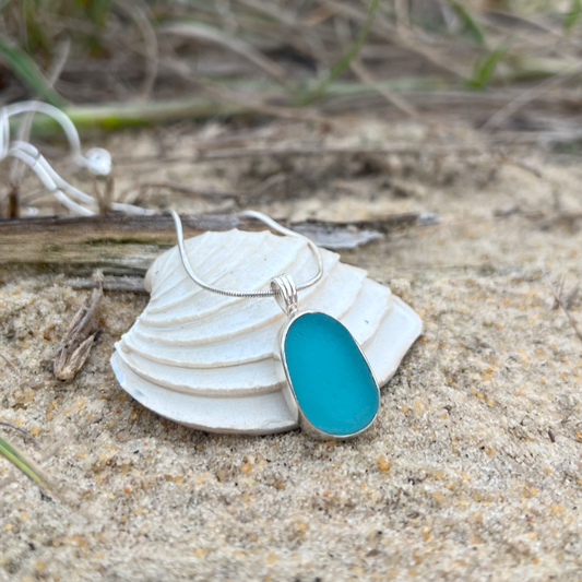 Ocean teal sea glass handset in Argentium silver by Mornington Sea Glass. Hangs on a 40 or 45cm sterling silver belcher chain.