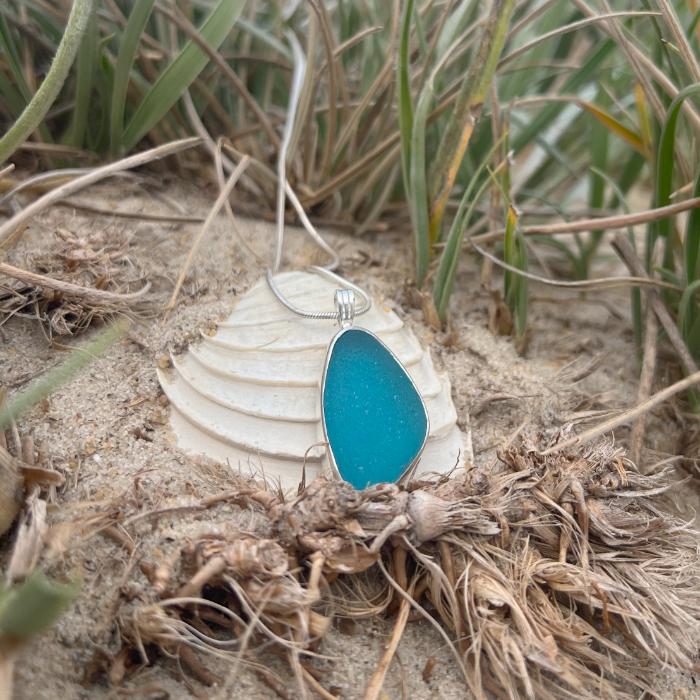 Ocean Teal sea glass set in silver pendant by Mornington Sea Glass. Hangs on a 40 or 45cm sterling silver snake chain.