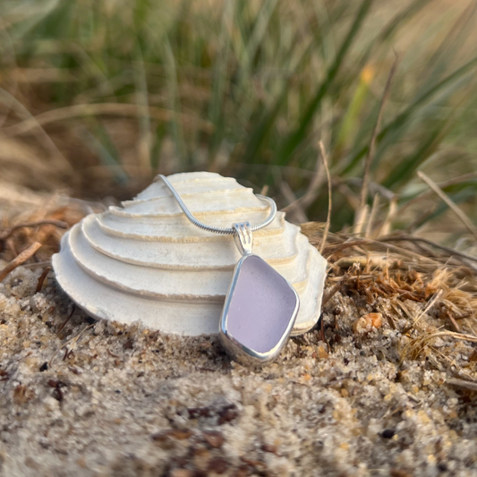 Purple sea glass set in silver pendant by Mornington Sea Glass. Hangs on a 40 or 45cm sterling silver snake chain.
