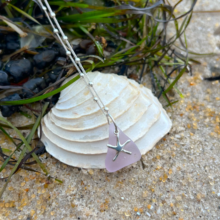 Purple sea glass and sterling silver starfish pendant by Mornington Sea Glass. Hangs on a 40cm + 5cm extension ball detail chain.