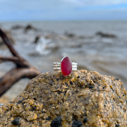 Rare red sea glass set in silver on a cast driftwood inspired silver ring band by Mornington Sea Glass. Size 8.