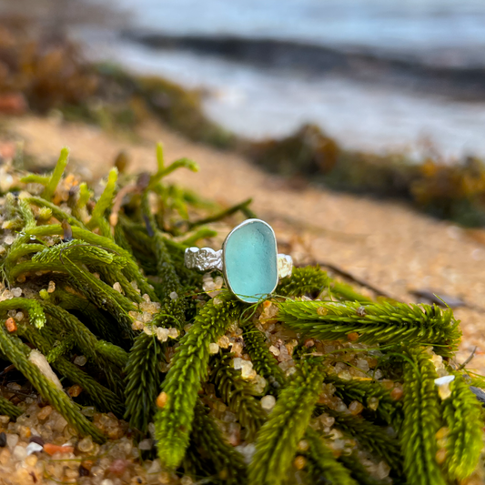 Blue sea glass set in silver on organic hammered ring band by Mornington Sea Glass. Size 7 1/2
