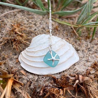 Ocean teal sea glass and sterling silver starfish pendant by Mornington Sea Glass. Hangs on a 40cm + 5cm extension ball detail chain.