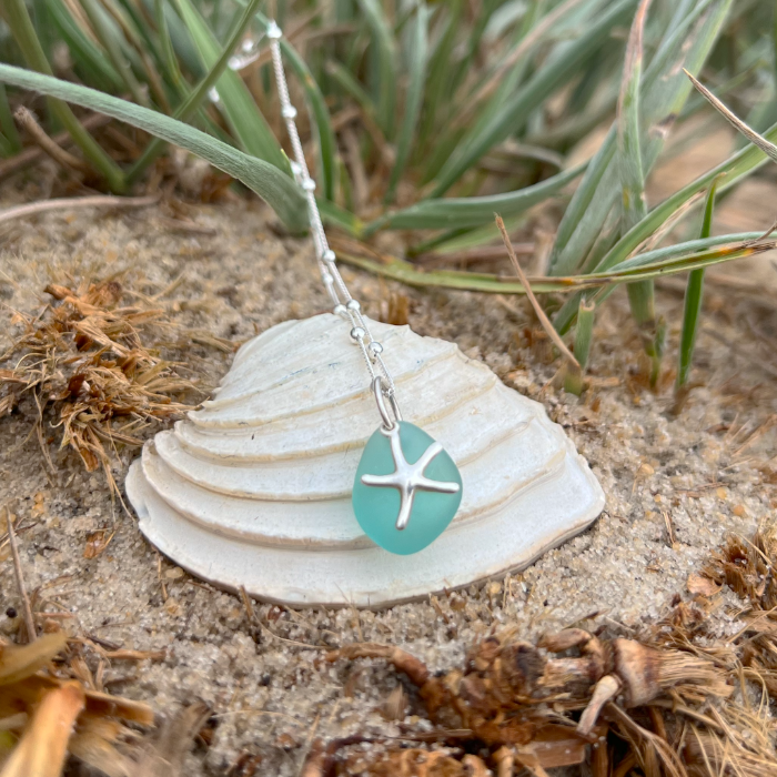 Aqua  teal sea glass and sterling silver starfish pendant by Mornington Sea Glass. Hangs on a 40cm + 5cm extension ball detail chain.