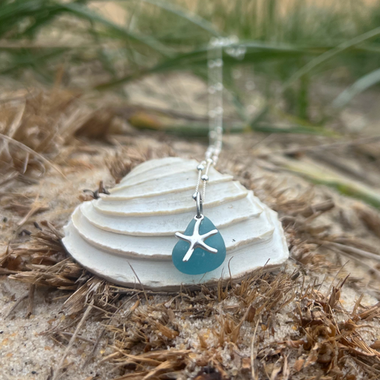 Ocean blue sea glass and sterling silver starfish pendant by Mornington Sea Glass. Hangs on a 40cm + 5cm extension ball detail chain.