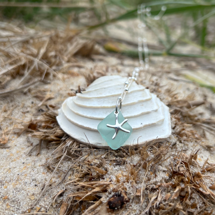 Soft blue  sea glass and sterling silver starfish pendant by Mornington Sea Glass. Hangs on a 40cm + 5cm extension ball detail chain.