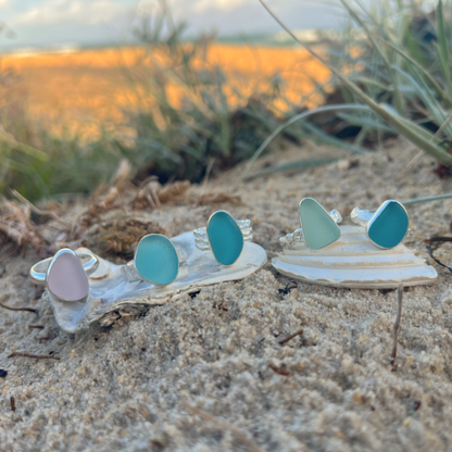 Sea glass rings set in silver by Mornington Sea Glass in different sea glass colours.