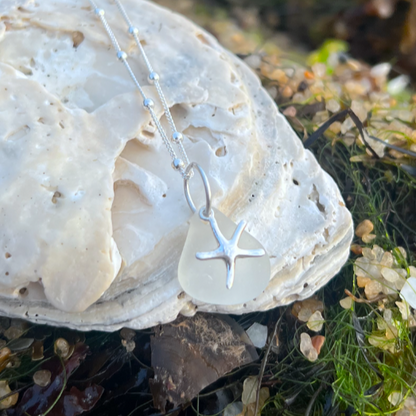 White sea glass and sterling silver starfish pendant by Mornington Sea Glass. Hangs on a 40cm + 5cm extension ball detail chain.