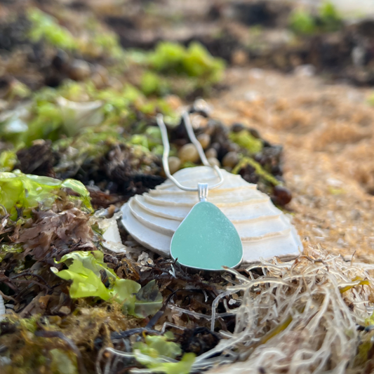 Seafoam sea glass set in silver pendant by Mornington Sea Glass. Hangs on a 40 or 45cm sterling silver snake chain.