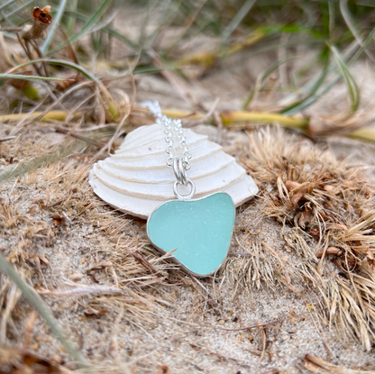 Seafoam green naturally shaped sea glass heart set in silver pendant by Mornington Sea Glass. Comes with a 40 or 45cm sterling silver  chain.