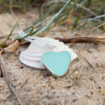 Seafoam green naturally shaped sea glass heart set in silver pendant by Mornington Sea Glass. Comes with a 40 or 45cm sterling silver  chain.