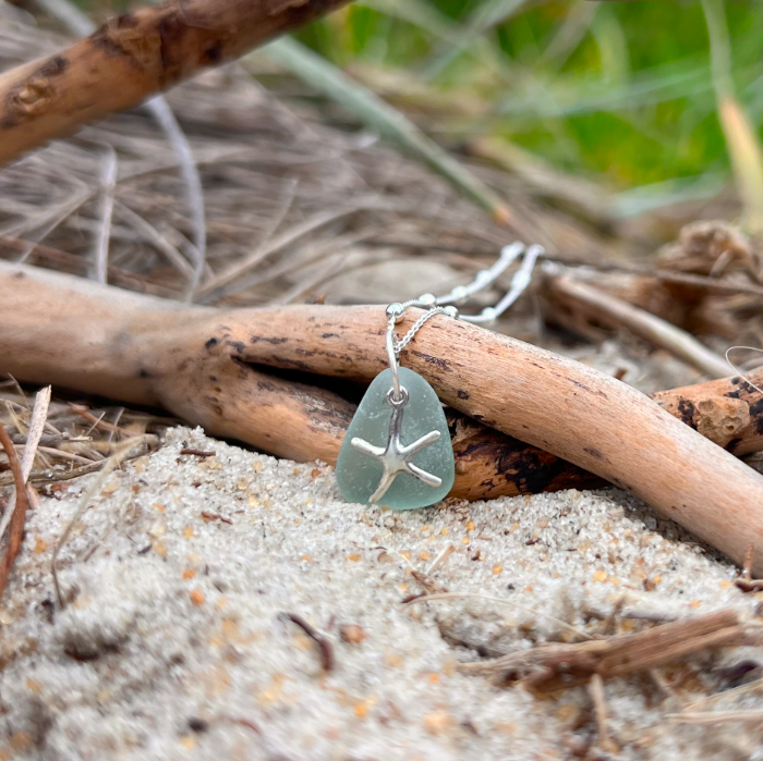 Seafoam sea glass and sterling silver starfish pendant by Mornington Sea Glass. Hangs on a 40cm + 5cm extension ball detail chain.