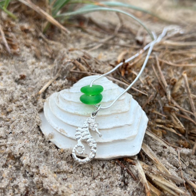 Green sea glass and silver seahorse charm necklace by Mornington Sea Glass. Hangs on a 40 or 45cm sterling silver snake chain.