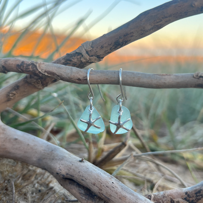 Soft blue sea glass and sterling silver sea star earrings  by Mornington Sea Glass. 