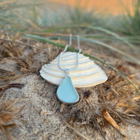 Soft blue sea glass set in silver pendant by Mornington Sea Glass. Hangs on 40cm or 45cm sterling silver snake chain.