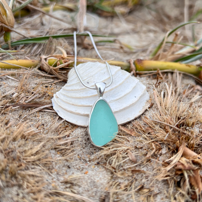 Soft green sea glass set in silver pendant by Mornington Sea Glass. hangs on a 0 or 45cm 1mm sterling silver snake chain.