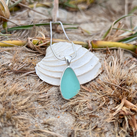 Soft green sea glass set in silver pendant by Mornington Sea Glass. hangs on a 0 or 45cm 1mm sterling silver snake chain.