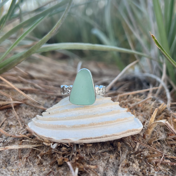 Seafoam sea glass set in silver on a rippled ring band by Mornington Sea Glass. Size 8 1/2.