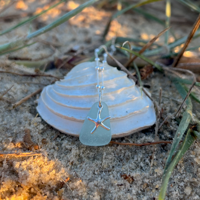 Seafoam sea glass and sterling silver starfish pendant by Mornington Sea Glass. Hangs on a 40cm + 5cm extension ball detail chain.