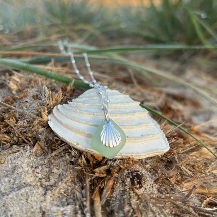 Soft green sea glass and sterling silver shell  pendant by Mornington Sea Glass. Hangs on a 40cm + 5cm extension ball detail chain.
