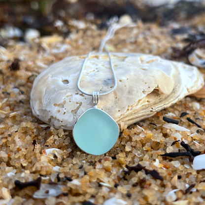 Soft blue sea glass set in silver pendant by Mornington Sea Glass. Hangs on 40cm or 45cm sterling silver snake chain.