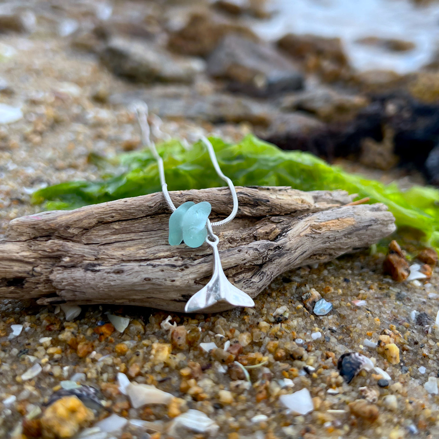 Soft blue sea glass and silver whale tail charm necklace by Mornington Sea Glass. Comes with a 40 or 45cm sterling silver snake chain.