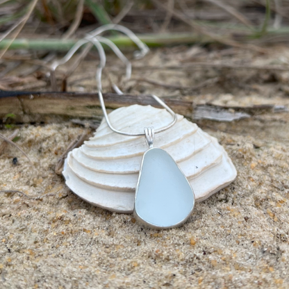White Sea glass set in silver pendant by Mornington Sea Glass. Hangs on a 40cm  or 45cm sterling silver snake chain