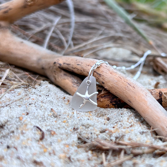 White sea glass and sterling silver starfish pendant by Mornington Sea Glass. Hangs on a 40cm + 5cm extension ball detail chain.