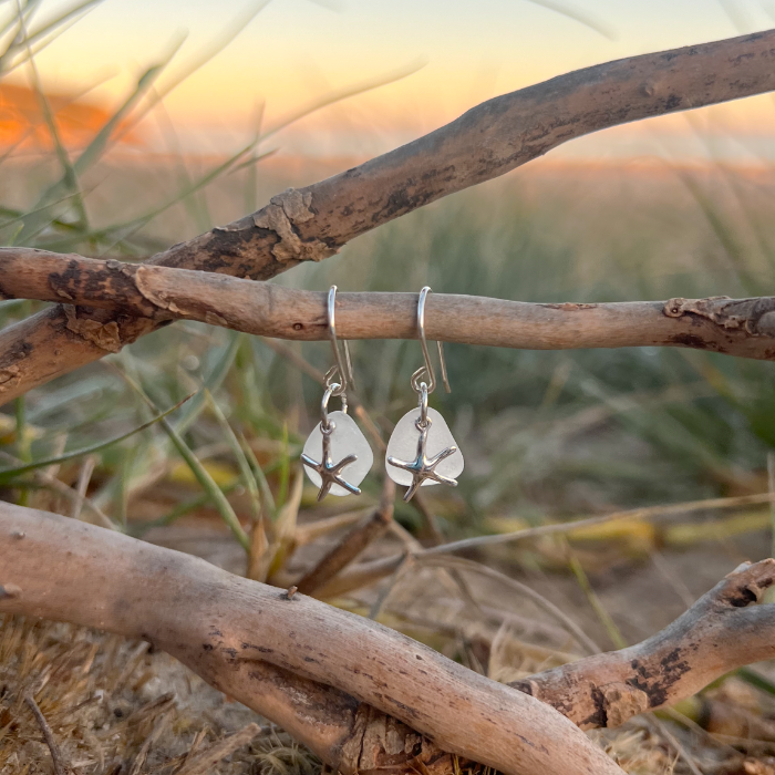 White sea glass and sterling silver starfish earrings  by Mornington Sea Glass. 