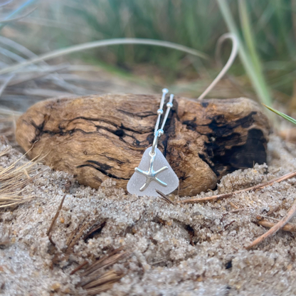 White sea glass and sterling silver starfish pendant by Mornington Sea Glass. Hangs on a 40cm + 5cm extension ball detail chain.