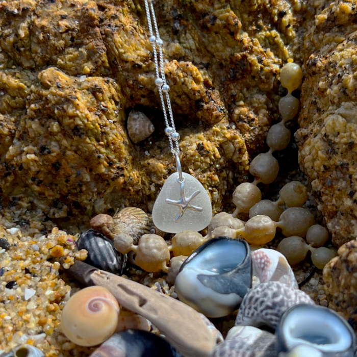 White sea glass and sterling silver starfish pendant by Mornington Sea Glass. Hangs on a 40cm + 5cm extension ball detail chain.
