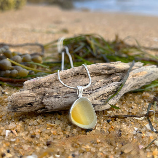 Rare yellow and white multi colour sea glass from England set in silver. Comes with a 40 or 45cm sterling silver chain. Pendant necklace by Mornington Sea Glass